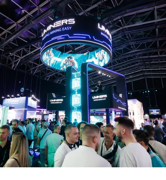 The expo floor with a lit tower stand